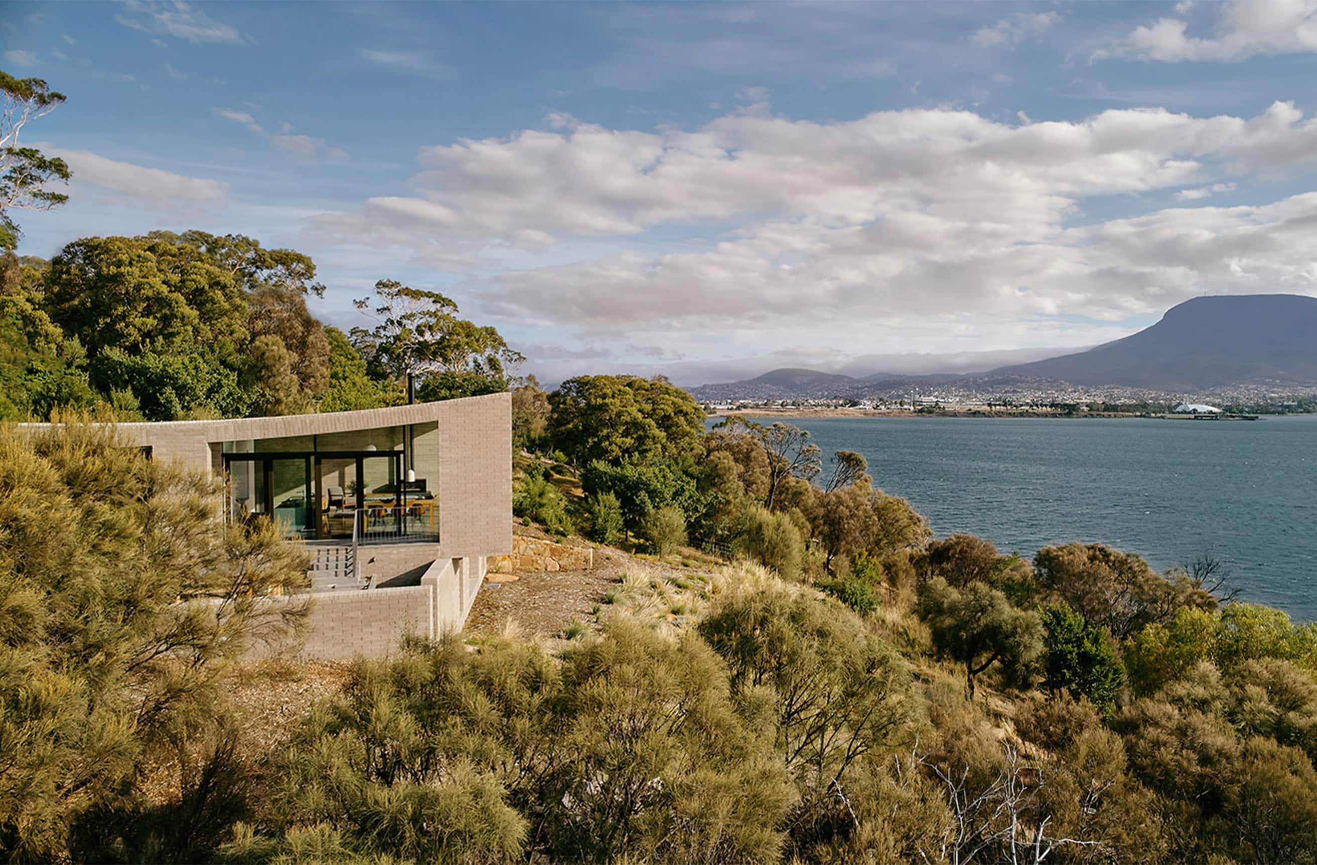 Modern lakeside house with scenic views in Tasmania.